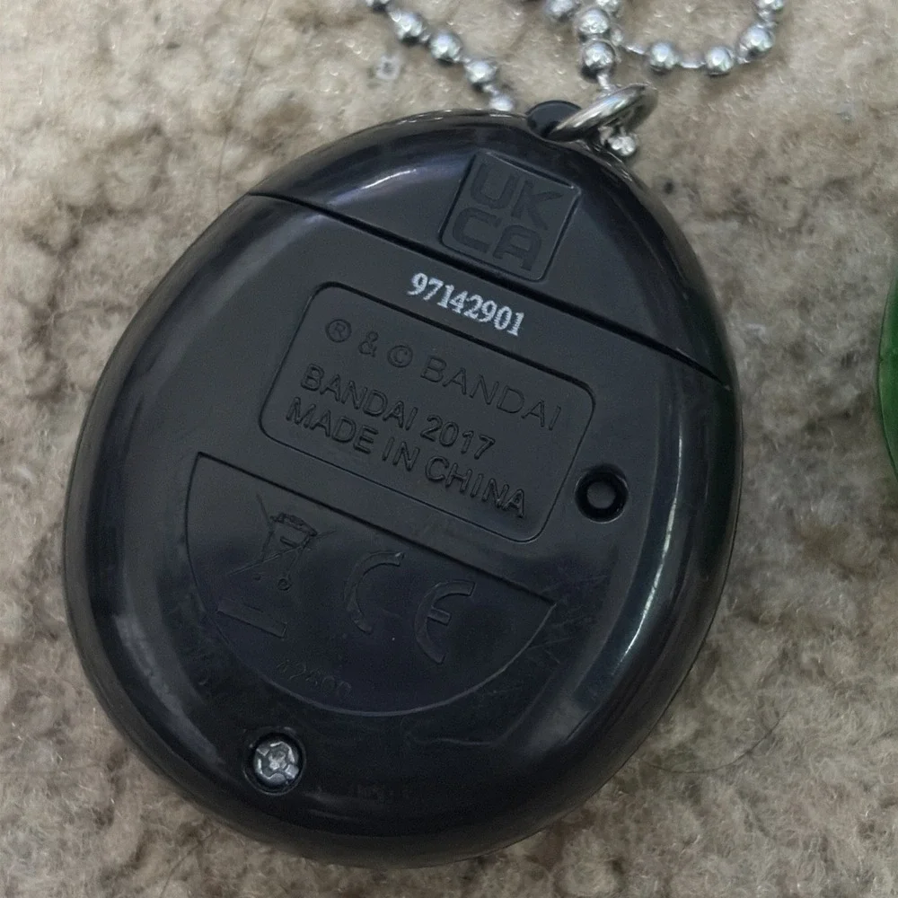 Bandai Tamagotchi Clear Green  Working And Purple Needs Battery